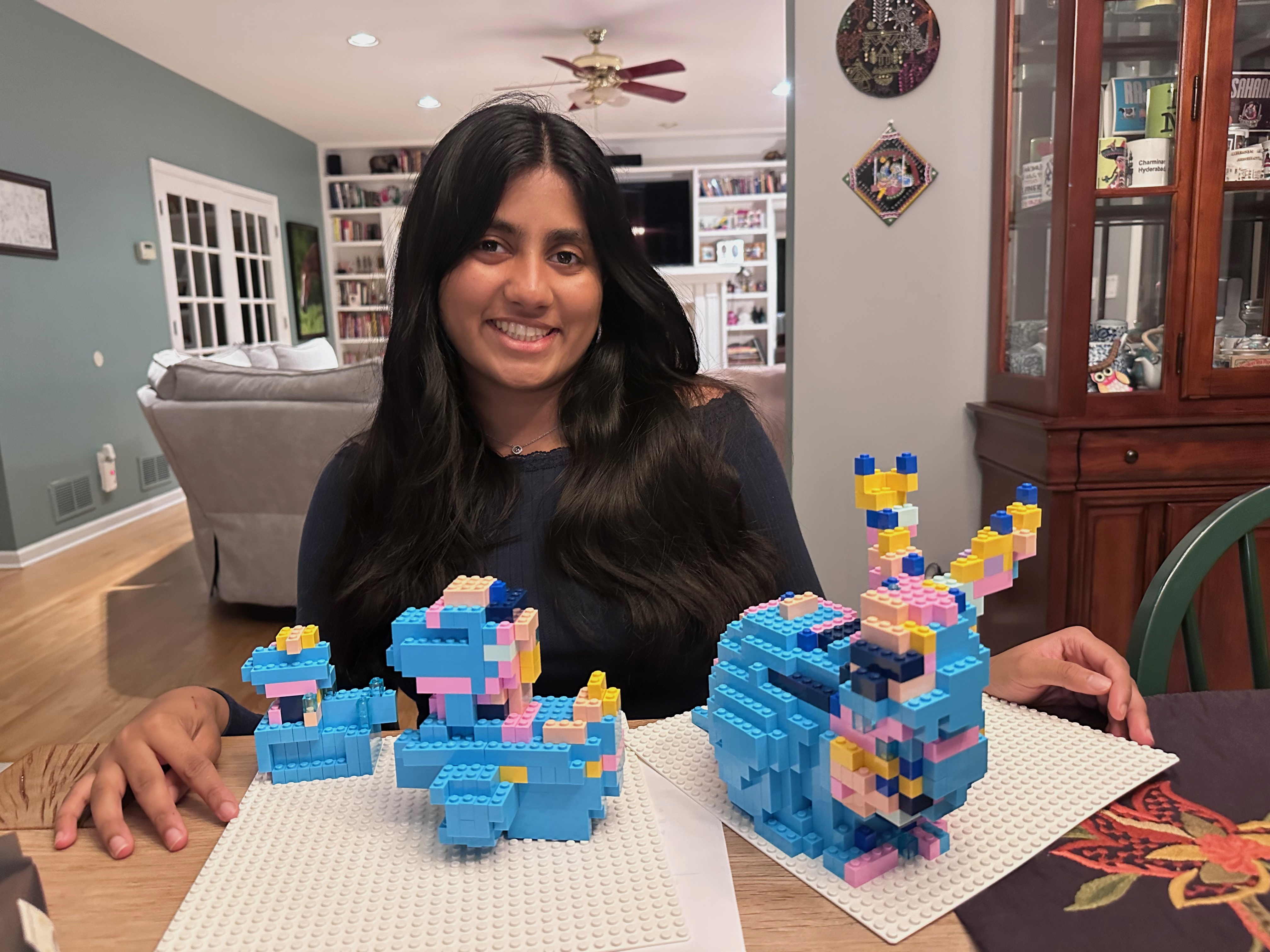Sahana Rajiv with LEGO models from her Girl Scout Gold Award project